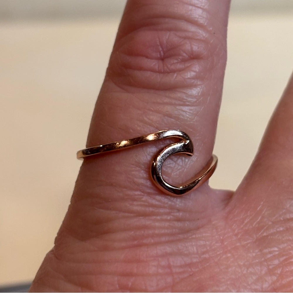 Ring with rose go over 925 sterling silver. Wave ring size 6 1/2 excellent condi